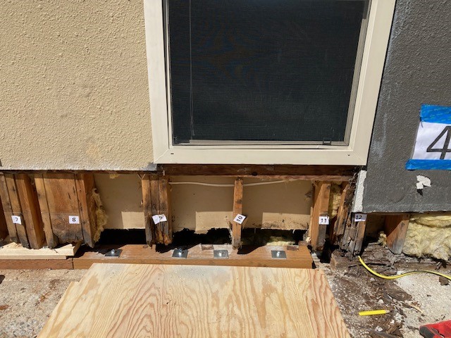 office building water damage restoration process. studs are numbered to decide which one to keep or to replace