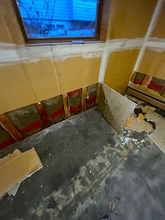 Basement Flood Restoration in Seattle, removing damaged drywall