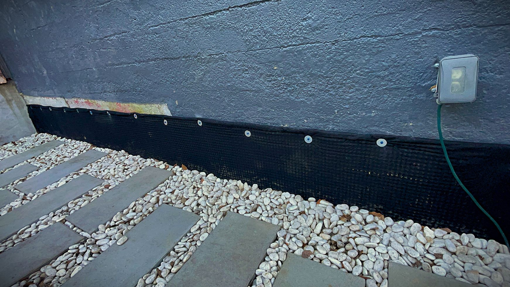 Engineering-grade basement waterproofing system to stop water intrusion in a Puget Sound home