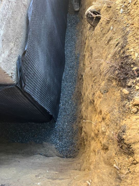 The process of membrane JDRAIN 400. installation for Basement waterproofing in seattle The process of membrane JDRAIN 400 on the seal painted wall. installation for Basement waterproofing in seattle