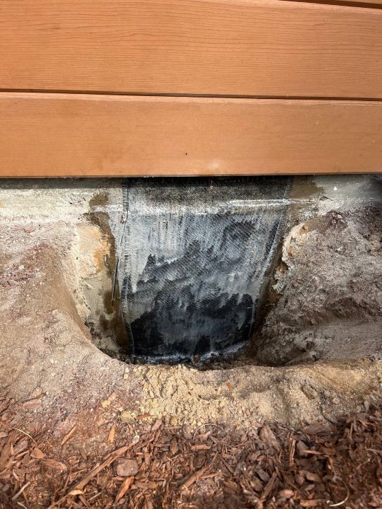 major vertical crack repair on the foundation wall with heavy duty epoxy injection and carbon fiber application