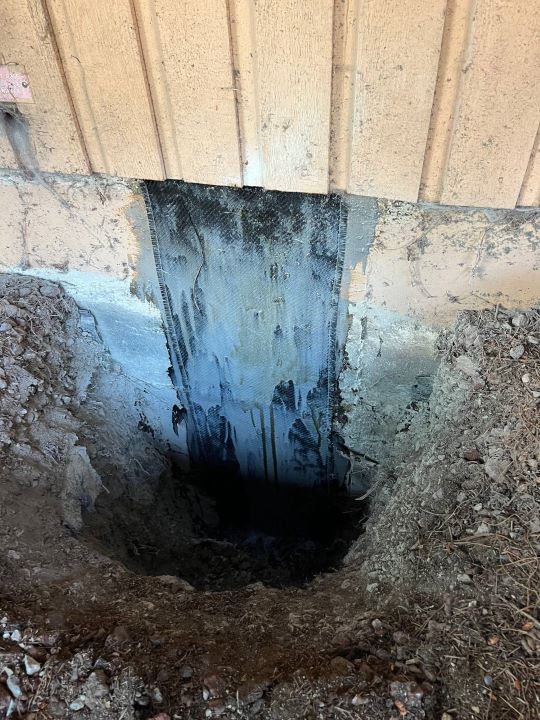 major vertical crack repair on the foundation wall with heavy duty epoxy injection and carbon fiber application