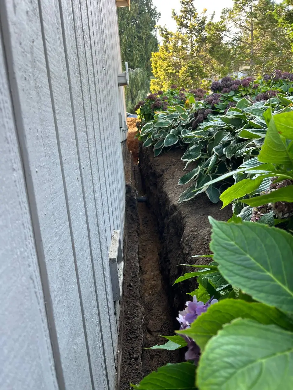 exterior-foundation-excavation-trench-arlington-wa Foundation drainage and waterproofing work by Basement Expert