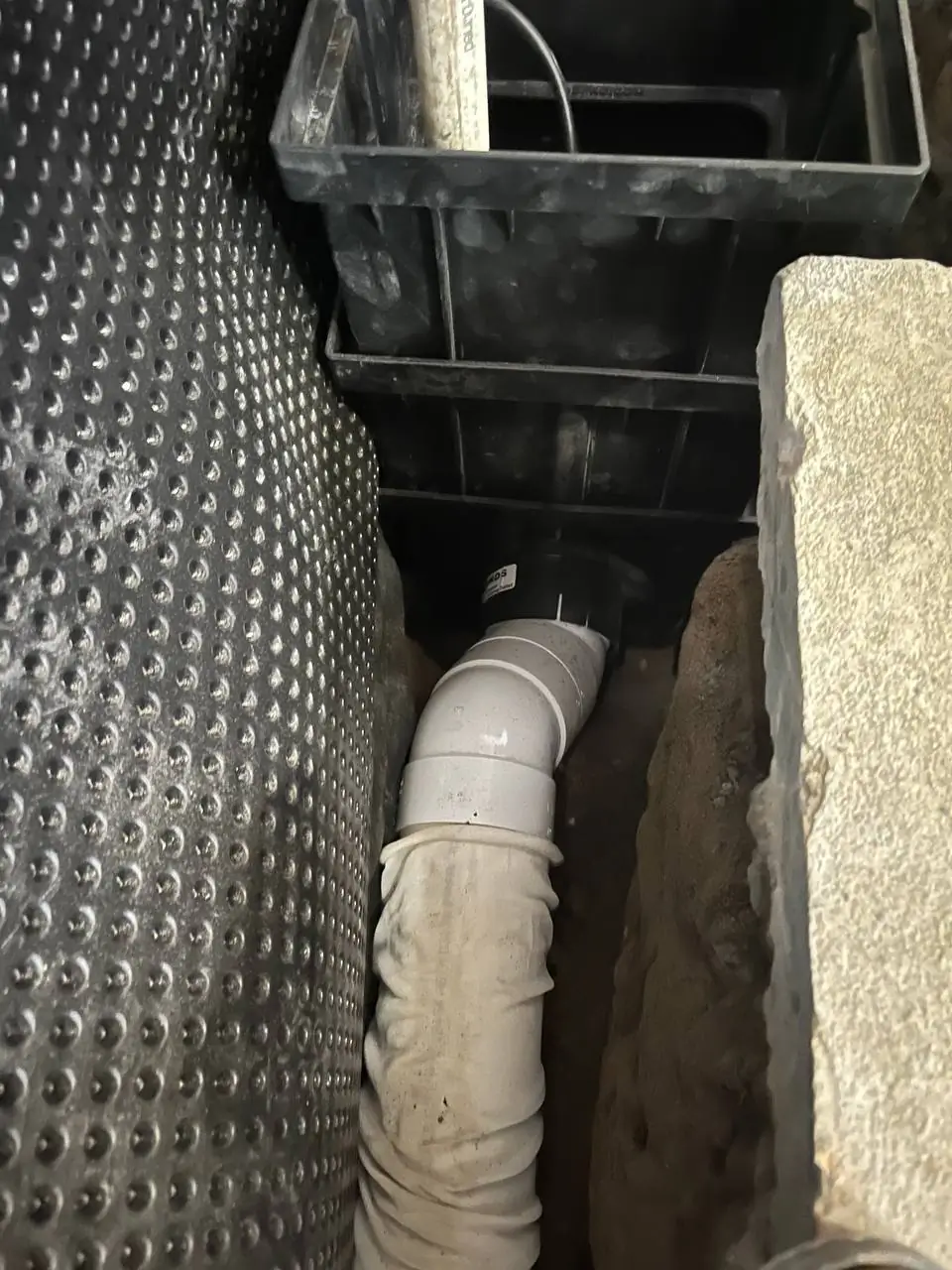 Excavation trench for exterior footing drain installation