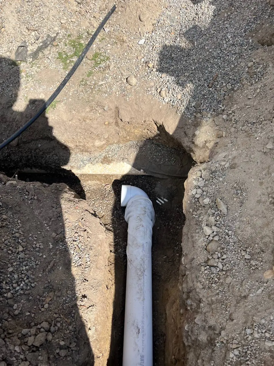 Excavation trench for exterior footing drain installation